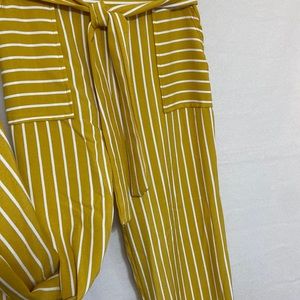 Women’s slacks with a tie.